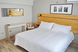 Rúm í herbergi á Hotel Cinco Tierras