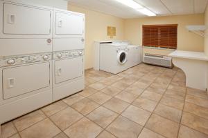 a laundry room with a washer and dryer at Candlewood Suites Elgin – Northwest Chicago, an IHG Hotel in Elgin