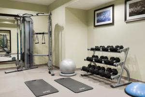 a fitness room with a gym with weights at Staybridge Suites - Miami International Airport by IHG in Miami