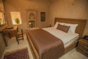 Tempat tidur dalam kamar di Helike in Cappadocia