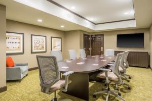 a conference room with a table and chairs at Staybridge Suites - Kansas City-Independence by IHG in Independence +67 photos