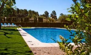 Bazén v ubytovaní Apartamentos Golf Place alebo v jeho blízkosti