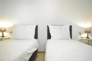 Postel nebo postele na pokoji v ubytování Rooms Monika