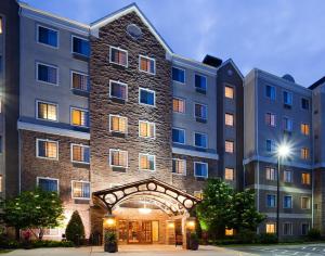 a large building with an archway in front of it at Staybridge Suites Minneapolis-Bloomington by IHG in Bloomington