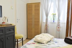 Postel nebo postele na pokoji v ubytování Rooms Monika