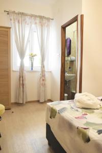 Postel nebo postele na pokoji v ubytování Rooms Monika