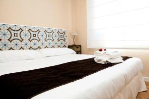 Posteľ alebo postele v izbe v ubytovaní Apartamentos Golf Place