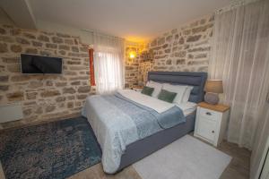 Postel nebo postele na pokoji v ubytování Antika Guesthouse