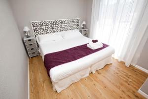 Posteľ alebo postele v izbe v ubytovaní Apartamentos Golf Place