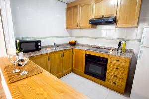 Kuchyňa alebo kuchynka v ubytovaní Apartamentos Golf Place