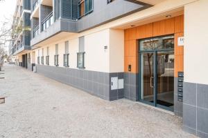 an empty street in front of a building at OCEANVIEW Luxury Amazing Views and Pool in Olhão