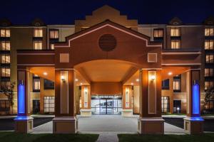an entrance to a hotel at night at Holiday Inn Express South Portland by IHG in South Portland