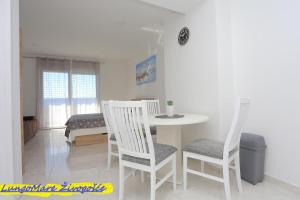 Ένα ή περισσότερα κρεβάτια σε δωμάτιο στο Apartmants villa Lungo Mare