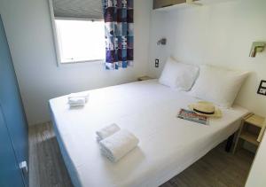 Camping San Damiano客房内的一张或多张床位