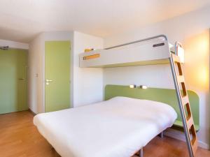 Postel nebo postele na pokoji v ubytování ibis budget Quimper