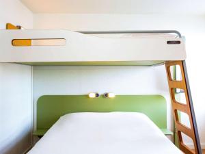Postel nebo postele na pokoji v ubytování ibis budget Quimper