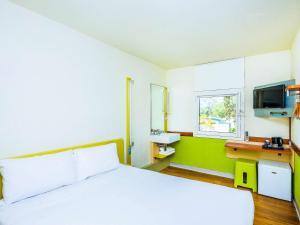 Postel nebo postele na pokoji v ubytování ibis Budget - Newcastle