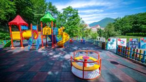 a number of small children playing in a park at Marxal Resort & Spa in Sheki