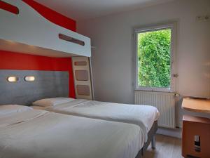 Postel nebo postele na pokoji v ubytování ibis budget Redon