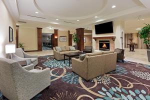 a living room with couches and a fireplace at Staybridge Suites San Antonio Downtown Convention Center, an IHG Hotel in San Antonio