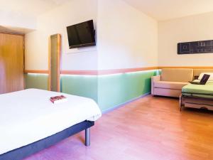 Postel nebo postele na pokoji v ubytování Ibis Budget Valence Sud + 37 fotografií