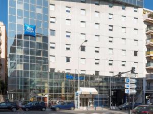 a large building with cars parked in front of it at ibis budget Nice Californie Lenval in Nice