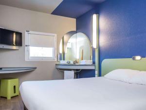 เตียงในห้องที่ Ibis Budget Sisteron