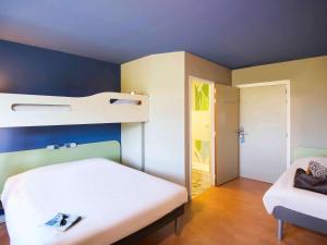 Katil atau katil-katil dalam bilik di Ibis Budget Porte de Camargue