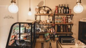 a room with a shelf filled with lots of items at Arte Brisa Hostal Boutique in Puerto Natales