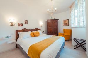 a bedroom with a bed with two teddy bears on it at TaoApartments - Casa Antonella in Taormina