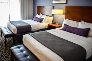 Cama o camas de una habitación en Bluemont Hotel