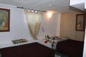 A bed or beds in a room at Half wooden rural apartment