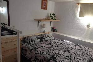 A bed or beds in a room at Half wooden rural apartment