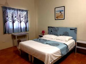 Ένα ή περισσότερα κρεβάτια σε δωμάτιο στο Gipsy Ranch Rooms