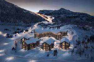 an aerial view of a resort in the snow at Fantastic apartment in Hemsedal, ski in ski out, Fyri Tunet in Hemsedal