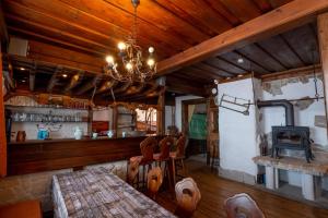 a room with a bar and a stove in it at Almhaus Dachsteinblick am Feuerkogel in Ebensee