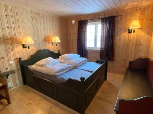 Postel nebo postele na pokoji v ubytování Løstegård Cabins