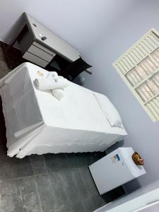 Un pat sau paturi într-o cameră la Hotel Morada Nobre