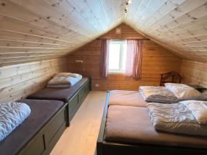 Postel nebo postele na pokoji v ubytování Løstegård Cabins
