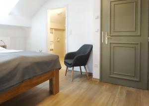 Postel nebo postele na pokoji v ubytování Hotel Garni Villa Areka