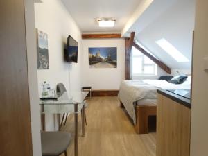 Postel nebo postele na pokoji v ubytování Hotel Garni Villa Areka