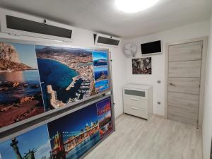 Televízia a/alebo spoločenská miestnosť v ubytovaní APARTAMENTO GALTOR 6