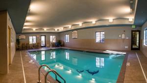 a large swimming pool in a building at Staybridge Suites Schererville, an IHG Hotel in Schererville