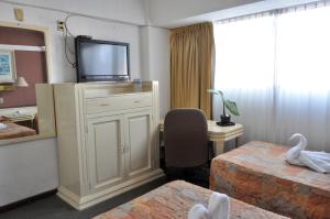 Postel nebo postele na pokoji v ubytování Hotel María Teresa