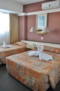 En eller flere senger på et rom på Hotel María Teresa
