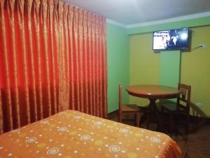 TV a/nebo společenská místnost v ubytování Residencial Norandes + 15 fotografií