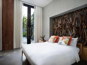 SO/ Sofitel Hua Hin客房内的一张或多张床位