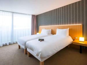 Postel nebo postele na pokoji v ubytování ibis Styles Kortrijk Expo