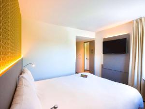 Postel nebo postele na pokoji v ubytování ibis Styles Kortrijk Expo