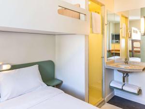 Кровать или кровати в номере ibis budget RJ Praia de Botafogo